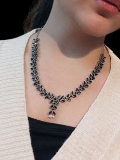 Premium brass stone necklace featuring intricate craftsmanship and stunning stone embellishments, perfect for a statement look.