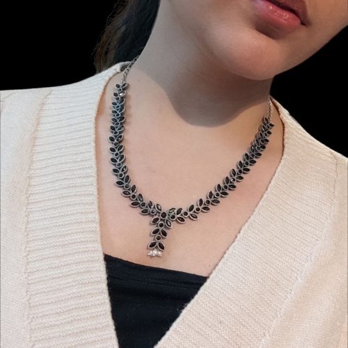 Premium brass stone necklace featuring intricate craftsmanship and stunning stone embellishments, perfect for a statement look.