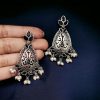 Elegant brass stone hanging stud earrings with intricate detailing, perfect for ethnic wear and festive occasions.