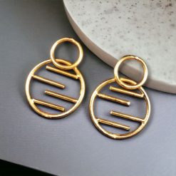 Contemporary gold-plated round shaped stud earrings with an elegant and minimalistic design, perfect for everyday wear and special occasions.