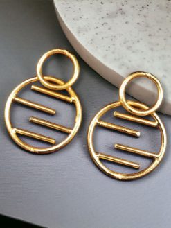 Contemporary gold-plated round shaped stud earrings with an elegant and minimalistic design, perfect for everyday wear and special occasions.