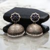 Handmade jhumka earrings with pearl and stone work, perfect for ethnic wear.