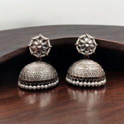 Handmade jhumka earrings with pearl and stone work, perfect for ethnic wear.