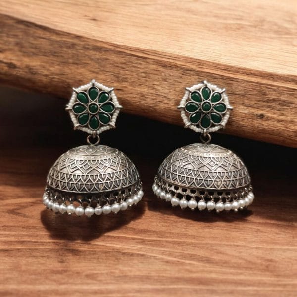 Handmade jhumka earrings with pearl and stone work, perfect for ethnic wear.