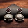 Handmade jhumka earrings with pearl and stone work, perfect for ethnic wear.