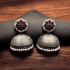 Handmade jhumka earrings with pearl and stone work, perfect for ethnic wear.