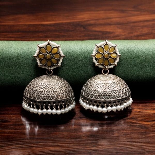 Handmade jhumka earrings with pearl and stone work, perfect for ethnic wear.