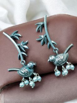 Handcrafted oxidized silver look-alike bird leaf earrings with intricate detailing, lightweight and stylish, perfect for casual and festive wear.