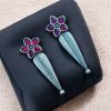 Oxidized Silver Stud Earrings with Floral Design and Delicate Stone Work.