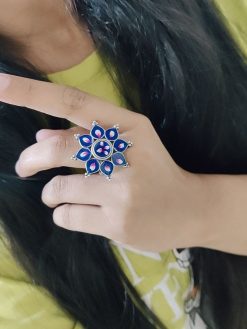 Oxidised handpainted flower finger ring with intricate meenakari work and adjustable design, perfect for traditional and ethnic wear.