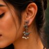 Handcrafted oxidized silver look-alike bird leaf earrings with intricate detailing, lightweight and stylish, perfect for casual and festive wear.