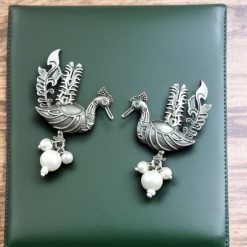 Elegant Ethnic Oxidized Peacock Stud Earrings with a silver look-alike design, featuring intricate detailing and a vintage charm for traditional and everyday wear.