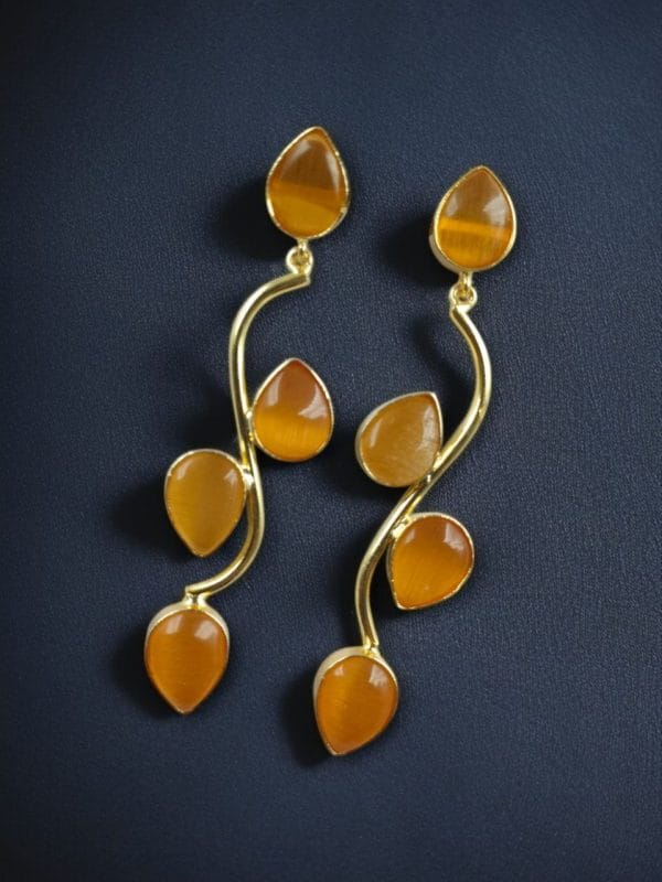 Lightweight gold-plated long earrings with stone danglers, elegant and stylish jewelry for women.