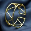 Handmade geometric cuff bangle with a trendy gold-plated finish, stylish and adjustable for women.