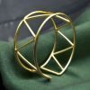 Handmade geometric cuff bangle with a trendy gold-plated finish, stylish and adjustable for women.