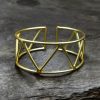 Handmade geometric cuff bangle with a trendy gold-plated finish, stylish and adjustable for women.