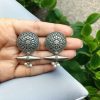 Elegant floral motif silver replica stud earrings with an oxidized finish, perfect for everyday wear.
