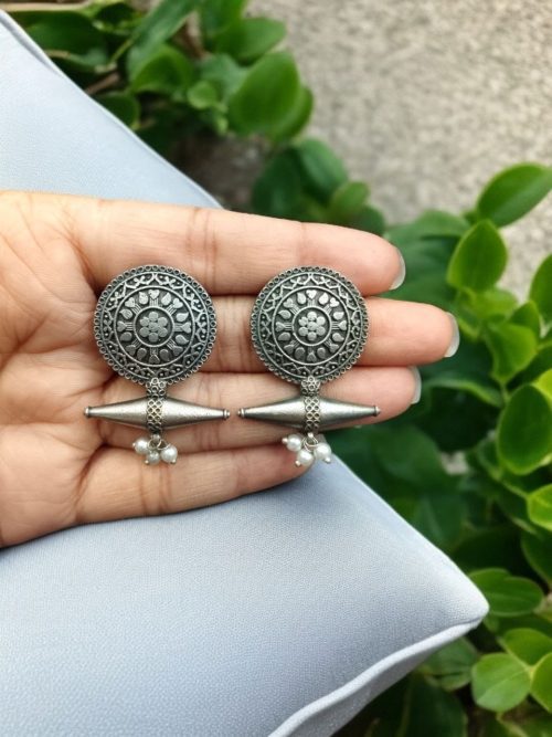 Elegant floral motif silver replica stud earrings with an oxidized finish, perfect for everyday wear.
