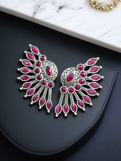 Handcrafted ancient feather style earrings with silver replica wings and intricate stone work.