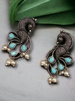 Oxidized lightweight peacock stud earrings with intricate pearl and stone detailing.