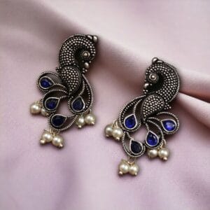 Oxidized lightweight peacock stud earrings with intricate pearl and stone detailing.