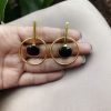 Gold-plated handmade earrings with a contemporary design for party wear.