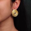 Stylish gold-plated spiral stud earrings with a modern Western design, perfect for any occasion.