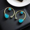 Elegant lightweight golden stone stud earrings in a unique Western style with a premium gold plated finish.