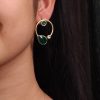 Elegant lightweight golden stone stud earrings in a unique Western style with a premium gold plated finish.