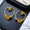 Elegant lightweight golden stone stud earrings in a unique Western style with a premium gold plated finish.