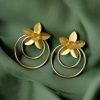 Elegant gold-plated half-circle flower earrings with floral and leaf design, adorned with sparkling stones for a stylish and contemporary look.