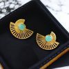 Modern gold-plated half-circle stone earrings with sparkling stones, featuring a stylish and contemporary design for an elegant look.