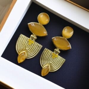 Elegant gold-plated stone earrings with a unique Western-style design, perfect for party wear and special occasions.