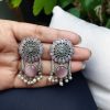 Handcrafted silver look earrings with Monalisa stone and pearl accents in a beautiful floral design, perfect for casual and festive wear.