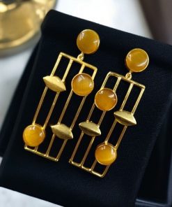 Traditional Indian wedding earrings, gold-plated and handmade with stunning stone accents, perfect for bridal and festive wear.