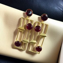 Traditional Indian wedding earrings, gold-plated and handmade with stunning stone accents, perfect for bridal and festive wear.