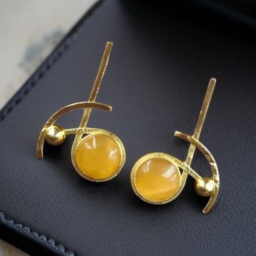 Elegant gold-plated Monalisa stone stud golden earrings for party wear.