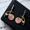 Elegant gold-plated Monalisa stone stud golden earrings for party wear.