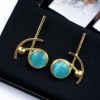 Elegant gold-plated Monalisa stone stud golden earrings for party wear.