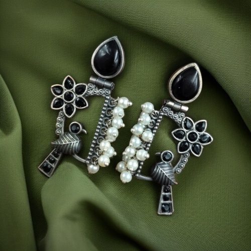 Traditional bird design oxidized silver replica bird earrings with pearl and stone work.