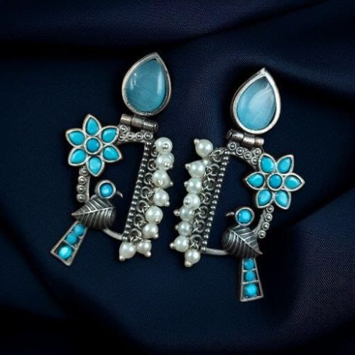Traditional bird design oxidized silver replica bird earrings with pearl and stone work.