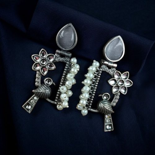 Traditional bird design oxidized silver replica bird earrings with pearl and stone work.