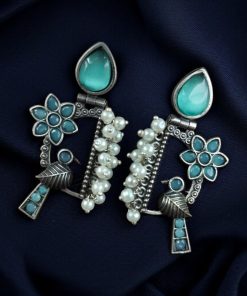 Traditional bird design oxidized silver replica bird earrings with pearl and stone work.