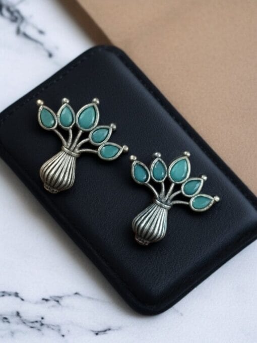 Elegant silver flower pot earrings with a stone for daily wear.