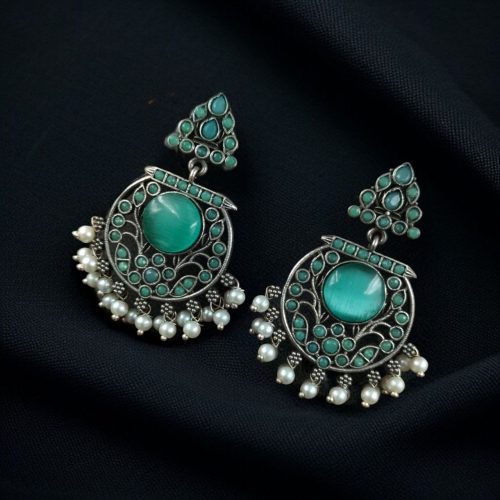 Designer floral earrings with silver replica finish, dangler stud style, and intricate stone detailing.