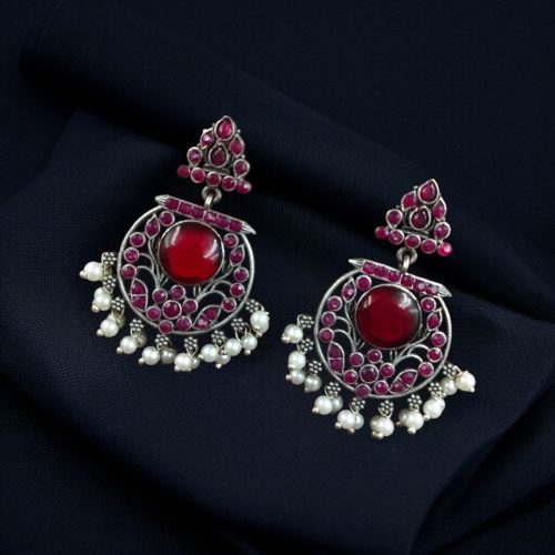 Designer floral earrings with silver replica finish, dangler stud style, and intricate stone detailing.