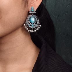 Designer floral earrings with silver replica finish, dangler stud style, and intricate stone detailing.