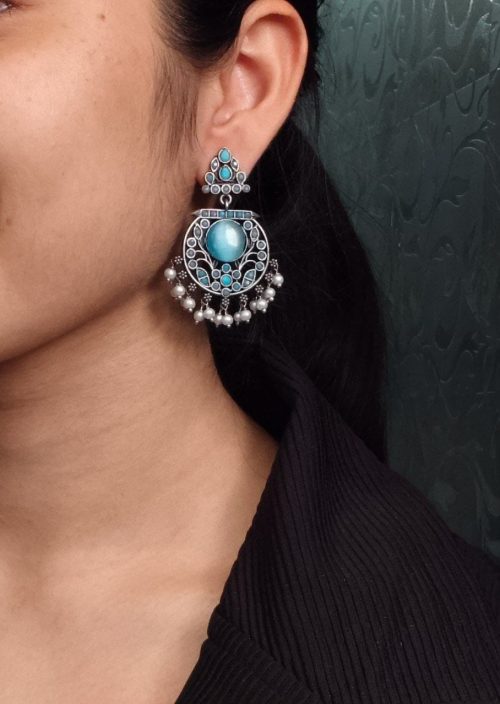 Designer floral earrings with silver replica finish, dangler stud style, and intricate stone detailing.