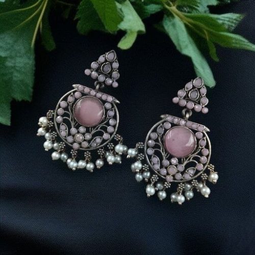 Designer floral earrings with silver replica finish, dangler stud style, and intricate stone detailing.