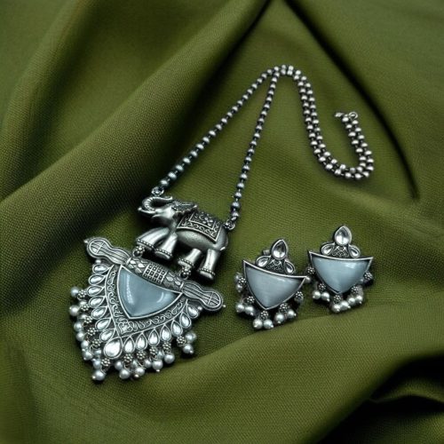Traditional oxidised elephant necklace set with Monalisa stone and pearl beads in antique silver finish.